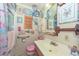 Bathroom with shower/tub combo, vanity, and eclectic decor at 3002 W Latham St, Phoenix, AZ 85009