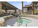 Relaxing hot tub with seating under a covered patio at 2025 E Campbell Ave # 260, Phoenix, AZ 85016