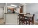 Kitchen breakfast bar and small dining area with four chairs at 2025 E Campbell Ave # 260, Phoenix, AZ 85016