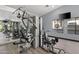 Modern gym with strength training equipment and large mirrors at 2025 E Campbell Ave # 260, Phoenix, AZ 85016