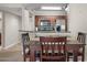 Simple dining area with four chairs adjacent to the kitchen at 2025 E Campbell Ave # 260, Phoenix, AZ 85016