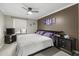 King-size bed, ceiling fan, and large window in this well-lit bedroom at 2025 E Campbell Ave # 260, Phoenix, AZ 85016