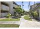 Community walkway with lush landscaping at 2025 E Campbell Ave # 260, Phoenix, AZ 85016