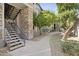Community walkway and stairs with trees at 2025 E Campbell Ave # 260, Phoenix, AZ 85016