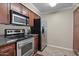 Kitchen with granite countertops and wood cabinets at 2025 E Campbell Ave # 260, Phoenix, AZ 85016