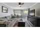 Living room features a sofa, coffee table, and access to a balcony at 2025 E Campbell Ave # 260, Phoenix, AZ 85016