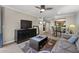Living room with sofa, coffee table, and view of kitchen at 2025 E Campbell Ave # 260, Phoenix, AZ 85016