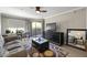 Living room features a sofa, coffee table, and access to a balcony at 2025 E Campbell Ave # 260, Phoenix, AZ 85016