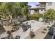 Outdoor grilling and seating area with fire pit in a community setting at 2025 E Campbell Ave # 260, Phoenix, AZ 85016