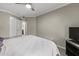 Bright bedroom with a king-size bed and a view of the hallway at 2025 E Campbell Ave # 260, Phoenix, AZ 85016