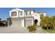 Two-story house with a three-car garage and a nicely landscaped front yard at 26137 N 52Nd Ave, Phoenix, AZ 85083