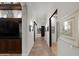 Long hallway with tiled floors and built-in shelving at 2608 S Sycamore Village Dr, Gold Canyon, AZ 85118