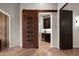 Hallway with unique barn door leading to pantry and bath at 2608 S Sycamore Village Dr, Gold Canyon, AZ 85118