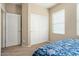 Bedroom with a full-size bed and a large closet at 22303 N Montecito Ave, Sun City West, AZ 85375