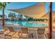 Resort-style pool with shaded seating area at 22303 N Montecito Ave, Sun City West, AZ 85375