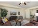 Spacious living room featuring comfortable seating and a large TV at 22303 N Montecito Ave, Sun City West, AZ 85375