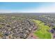 Aerial view of a luxury community with golf course, lake, and upscale homes at 22303 N Montecito Ave, Sun City West, AZ 85375