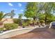 Landscaped backyard with patio and mature trees at 22303 N Montecito Ave, Sun City West, AZ 85375
