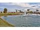 Tranquil pond with a fountain in a resort community at 22303 N Montecito Ave, Sun City West, AZ 85375