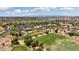 Aerial view of a community with a clubhouse and golf course at 22303 N Montecito Ave, Sun City West, AZ 85375