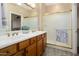 Bathroom with double vanity, shower, and updated fixtures at 22303 N Montecito Ave, Sun City West, AZ 85375