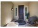 Inviting entryway with decorative door and a comfortable sitting area at 22303 N Montecito Ave, Sun City West, AZ 85375