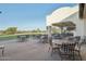 Outdoor patio with seating area and golf course views at 22303 N Montecito Ave, Sun City West, AZ 85375