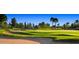 Rolling greens and sand traps of a golf course at 22303 N Montecito Ave, Sun City West, AZ 85375