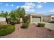 Single-story home with desert landscaping and driveway at 22303 N Montecito Ave, Sun City West, AZ 85375