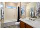 Bathroom with tub, shower, and updated vanity at 22303 N Montecito Ave, Sun City West, AZ 85375
