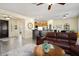 Open living room with kitchen views and a cozy seating area at 22303 N Montecito Ave, Sun City West, AZ 85375
