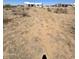 Aerial view of a new construction home in a desert setting at 22261 W Ocupado Dr, Wittmann, AZ 85361