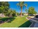 Landscaped backyard oasis with lush grass and mature trees at 4622 E Flower Ave, Mesa, AZ 85206