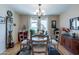 Well-lit dining area featuring a round table, four chairs, and hardwood floors at 4622 E Flower Ave, Mesa, AZ 85206