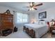 Bright bedroom featuring a comfortable bed and antique dresser at 4622 E Flower Ave, Mesa, AZ 85206