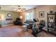 Gathering room with large TV, exercise equipment, and ample space at 4622 E Flower Ave, Mesa, AZ 85206