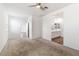 Spacious bedroom with carpet flooring and en-suite bathroom access at 15112 W Hadley St, Goodyear, AZ 85338