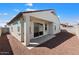 Spacious backyard with covered patio and gravel landscaping at 15112 W Hadley St, Goodyear, AZ 85338