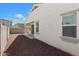 Landscaped backyard with gravel and block wall at 15112 W Hadley St, Goodyear, AZ 85338