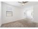 Bright bedroom with neutral carpeting and double windows at 15112 W Hadley St, Goodyear, AZ 85338
