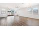 Open living room with sliding glass doors leading to the backyard at 15112 W Hadley St, Goodyear, AZ 85338