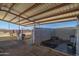 Barn with concrete flooring, stalls, and tack room at 52108 N 461St. Ave, Wickenburg, AZ 85390