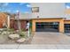 Contemporary townhouse featuring a modern garage door at 6525 E Cave Creek Rd # 18, Cave Creek, AZ 85331