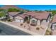 Single-story home with a three-car garage and landscaped front yard, mountain views at 1946 E Everett Dr, Phoenix, AZ 85022