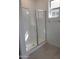 Glass enclosed shower with tiled flooring at 20542 N 226Th Ln, Surprise, AZ 85387