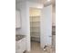 Walk in pantry with ample shelving for storage at 20542 N 226Th Ln, Surprise, AZ 85387