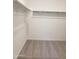 Large walk-in closet with double hanging rods at 20542 N 226Th Ln, Surprise, AZ 85387