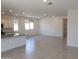 Open concept living room and kitchen with tile floors at 20542 N 226Th Ln, Surprise, AZ 85387