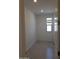 Small bedroom with tile floor and single window at 20542 N 226Th Ln, Surprise, AZ 85387
