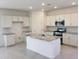 Modern kitchen with granite island and white cabinets at 20542 N 226Th Ln, Surprise, AZ 85387